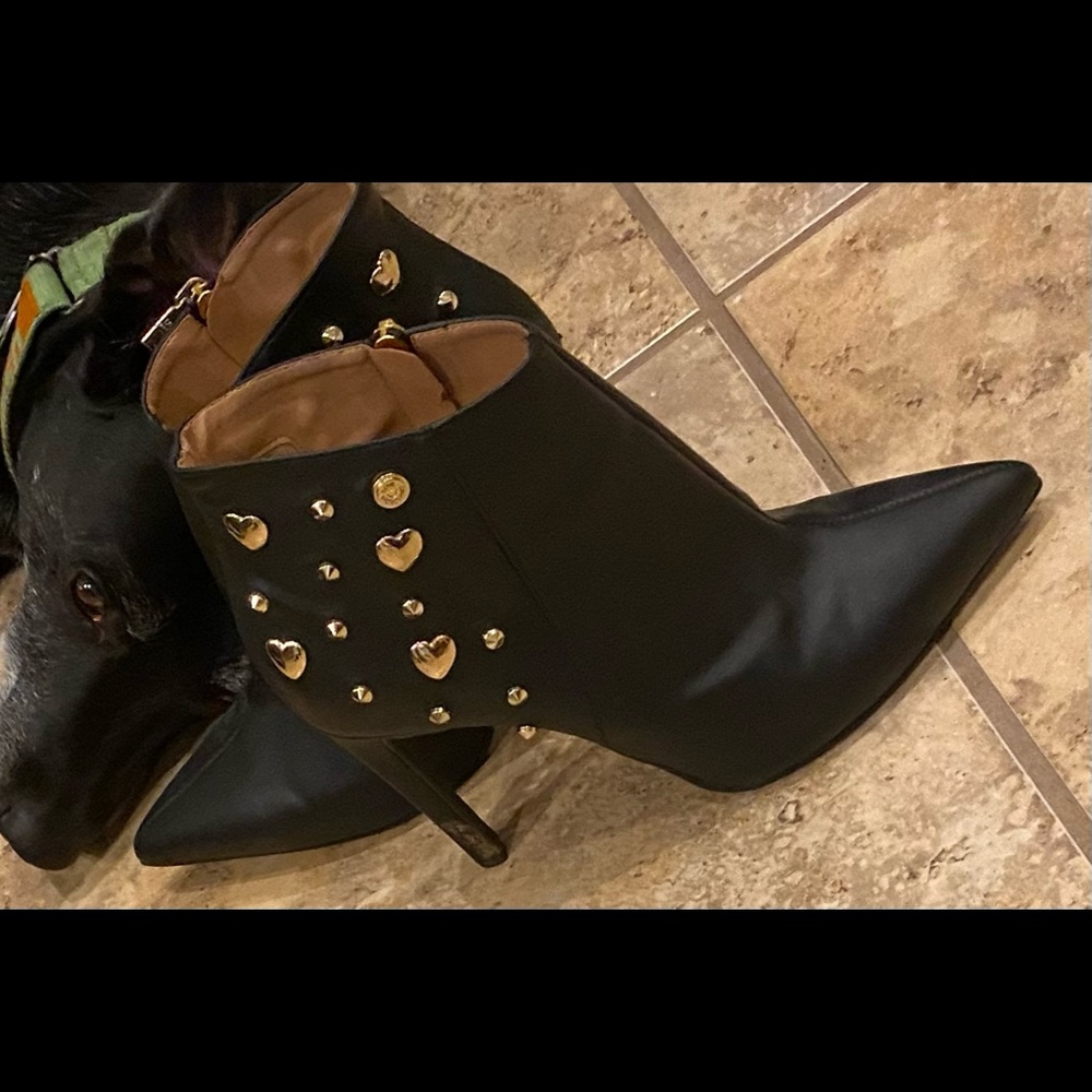 Black leather boots with gold charms